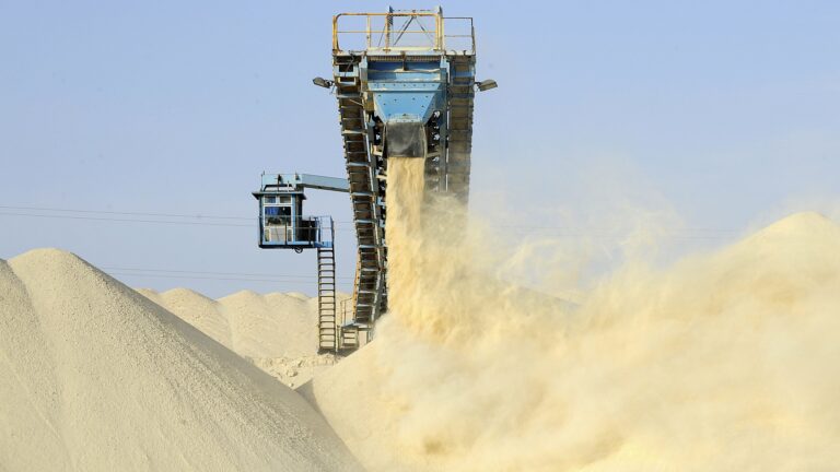 A picture taken on May 13, 2013 shows untreated phosphate being dropped off on a montain at the end of a conveyor belt at the Marca factory of the National Moroccan phosphates company (OCP/public), near Laayoune, the capial of Moroccan-controlled Western Sahara. As a global leader in the market for phosphate and its derivatives, OCP has been a key player in the international market since its founding in 1920, the worlds largest exporter of phosphate rock and phosphoric acid and one of the worlds largest fertilizer producers.    AFP PHOTOS/FADEL SENNA        (Photo credit should read FADEL SENNA/AFP/Getty Images)